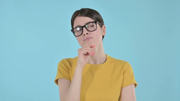 Curious Young Woman Thinking About Something on Purple Background