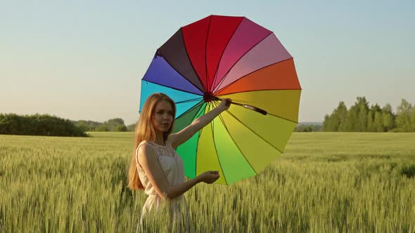 Cute Girl with a Multicolored Umbrella