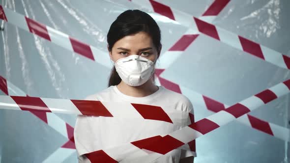 Portrait of a Woman, She Tears Off a Protective Tape and a Medical Mask. The Concept of Ending the