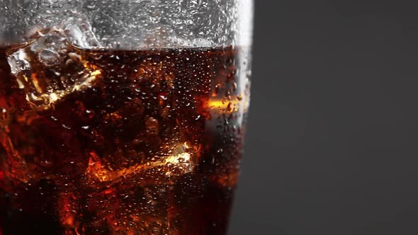 Carbonated Drink Cola in a Glass Glass with Ice