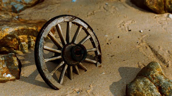 Old Wooden Cart Wheel at Sand Beach