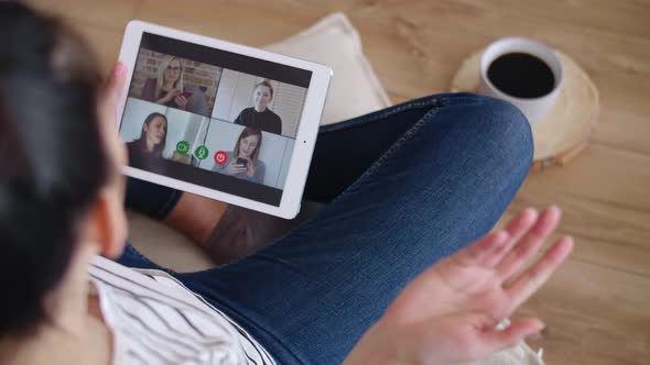 Tracking left video of woman having video conference with friends
