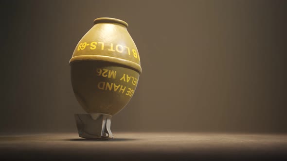 Falling M26 Grenade. Golden glitter explosion from the lemon grenade. 4K HD.