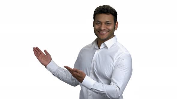 Successful Indian Businessman Pointing on Empty Copy Space