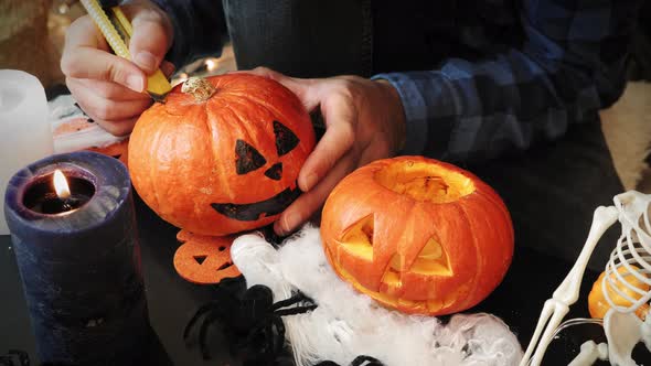 Carving pumpkin for Halloween. Jack o Lantern. 