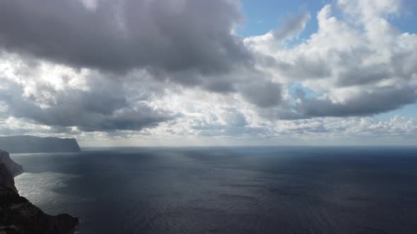 Abstract Airy Sky with Moving Plump Clouds Over the Sea Ocean