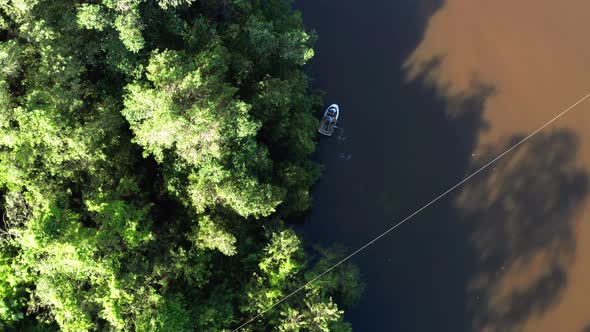 Rowing boat on Higuamo or Iguamo river in Dominican Republic. Aerial top-down forward