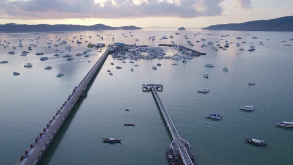 Aerial view of chalong bay with many boats yachts,longtail fishing boats,sailing boats in Phuket