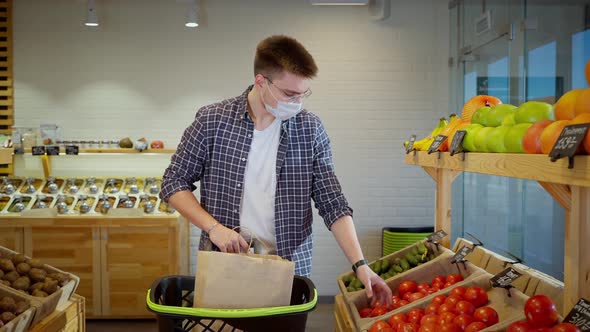 Greengrocery Shopper Choosing Fresh Tomatoes