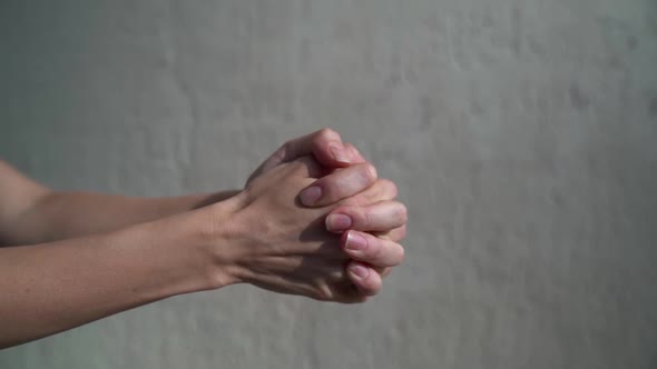 Woman Is Clenching Her Hands, Making Fist, Closeup of Palm, Gesticulating