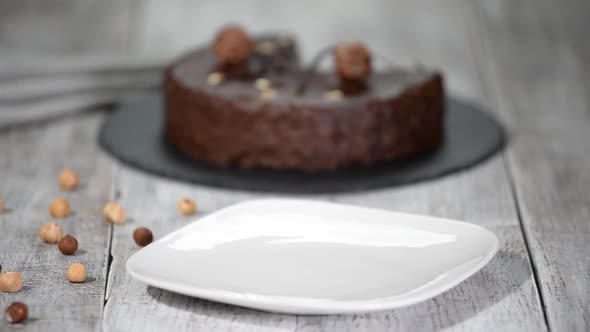 Piece of the French mousse cake with with chocolate glaze. Modern european cake pastry.	