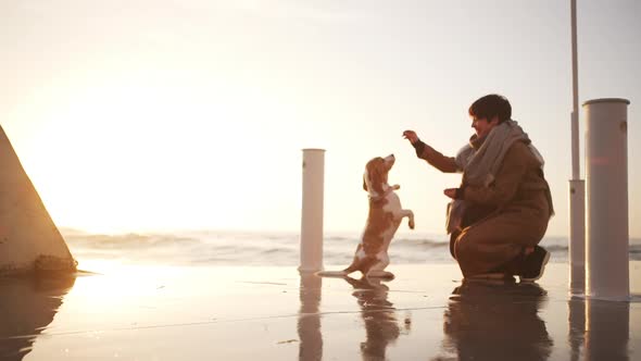 Attractive Girl Playing with Smart God on Sunrise Near the Seacost Slow Motion