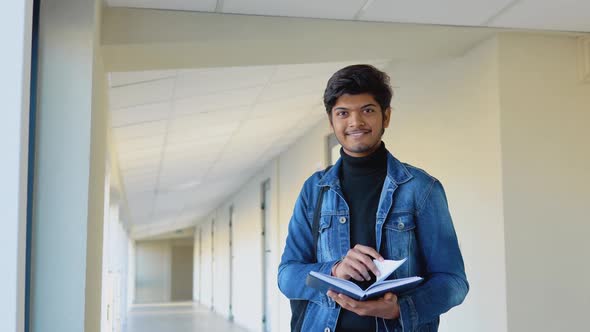 Indian Student with a Books in the University or College