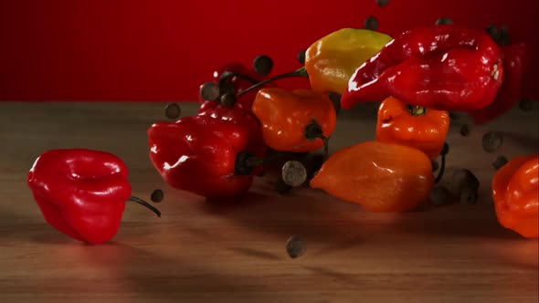 Peppers falling bouncing in ultra slow mo