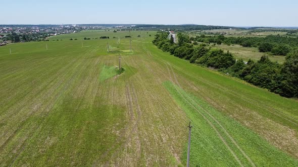 Aerial drone view of a flying over the rural agricultural landscape.