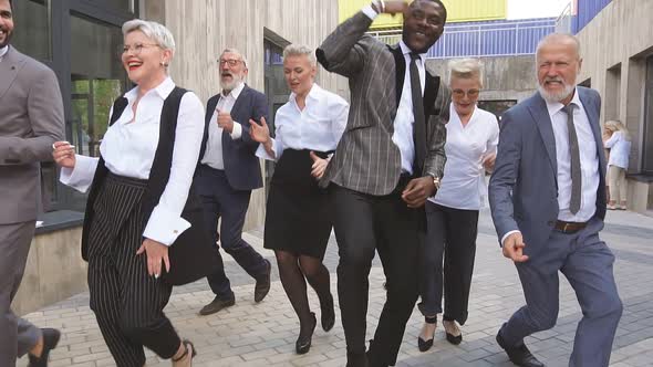 Portrait of Group of Multiracial Business People Performing Crazy Dance Moves