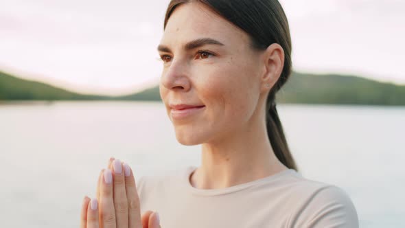 Portrait of Young Woman Enjoying Yoga Meditation Outdoors