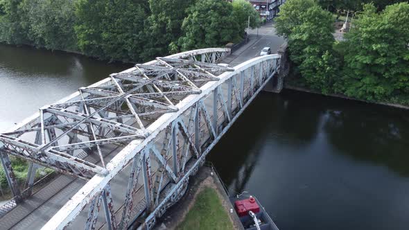 Aerial view vehicles crossing Manchester ship canal Victorian swing bridge Warrington England