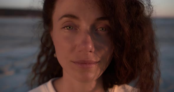 Portrait of a Young Woman Without Makeup in the Sunset Light