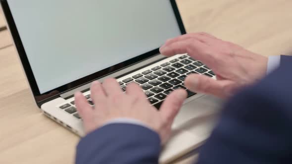 Hands Close Up of Old Businessman Typing on Laptop