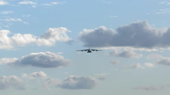 Heavy Airlift Cargo Airplane Climbing Out After Take Off, Sky Backdrop