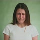 Upset Young Woman Cries with Sad Grimace on Green Background - VideoHive Item for Sale
