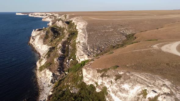 Bird'seye View of the Blue Sea a High Cliff of a Rocky Mountain in a Steppe Area