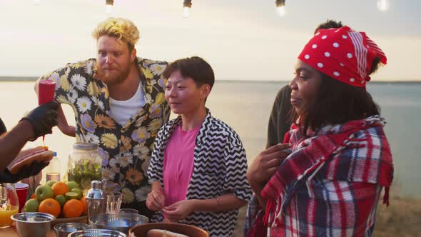 Young People Ordering Street Food at Summer Festival