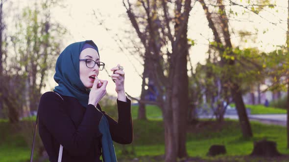 Beautiful Girl in Hijab Dyes Her Lips