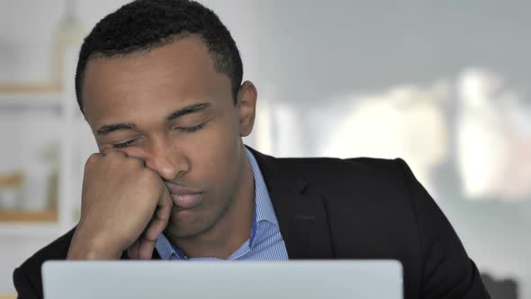 Close Up Of Tired Casual AfroAmerican Businessman Sleeping at Work