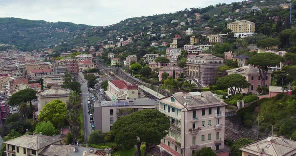 Train station and colorful hillside houses of Santa Margherita Ligure; aerial