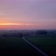 Aerial Cinematic Clip Drone Flying Over a Farm Field During Sunset - VideoHive Item for Sale