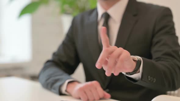 Close Up of Hand Gesture of Middle Aged Man Saying No By Finger Denial
