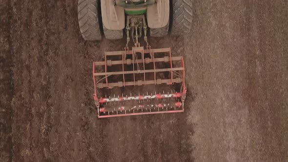 Tractor Plows a Field alt