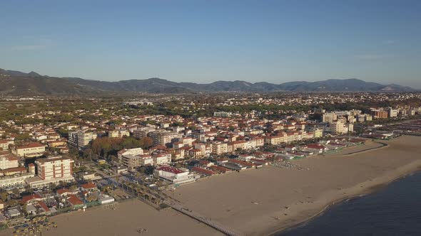 Pan Right Drone Shot of the Italian Town of Lido di Camaiore during Golden Hour