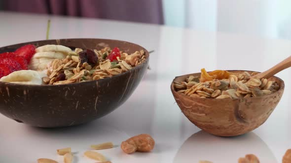 Coconut Bowl with Granola Oatmeal Nuts Fresh Berries and Fruits