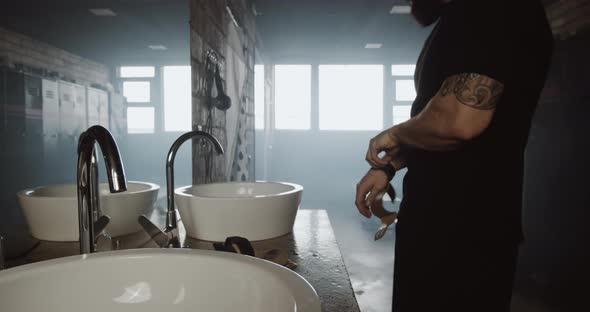 Sad Athletic Caucasian Young Man Washing Hands and Face Alone in Dark Gym Locker Room Motivation