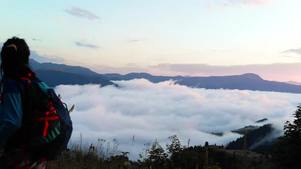 Hiker Pass In High Altitude Over Clouds