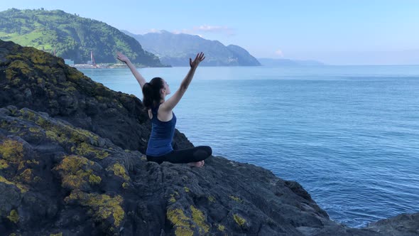 Girl Meditating at the Sea