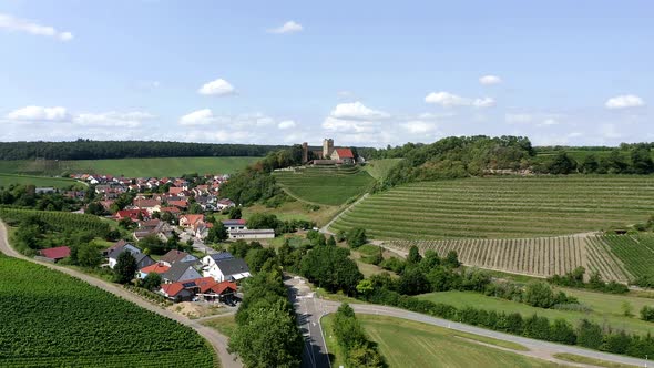 Drone shot of Neipperg Castle with vinyards, Germany