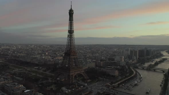 AERIAL: Drone Slowly Circling Eiffel Tower, Tour Eiffel in Paris, France with View on Seine River in