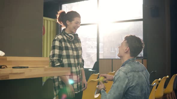 Two Young People Laughing and Enjoying Their Time Together