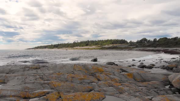 Aerial: low drone shot over rocky coastline, Jomfruland Norwegian