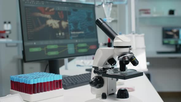 Close Up of Laboratory Microscope on Desk