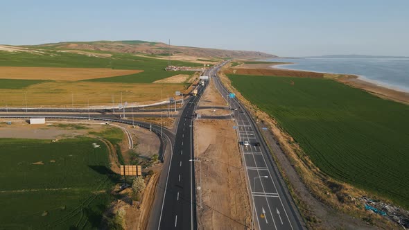 Aerial drone shot over a beautiful two way road network on the seaside in Alanya, Turkey on a sunny