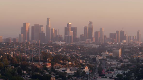 Residential houses and city skyline at sunset