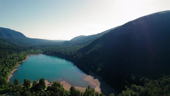 Beautiful Washington Nature Aerial With Turquoise Color Mountain Lake Surrounded By Trees