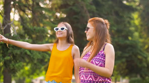 Teenage Girls or Friends Walking in Summer Park