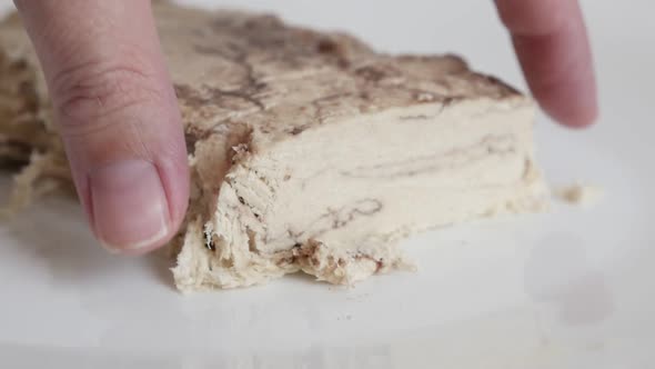 Taking halva sweet from plate slow motion  footage