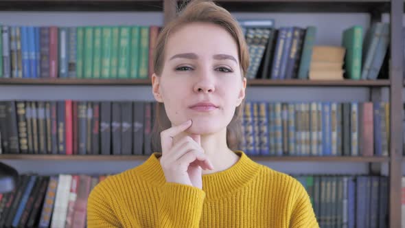 Portrait of Thinking Woman in Office